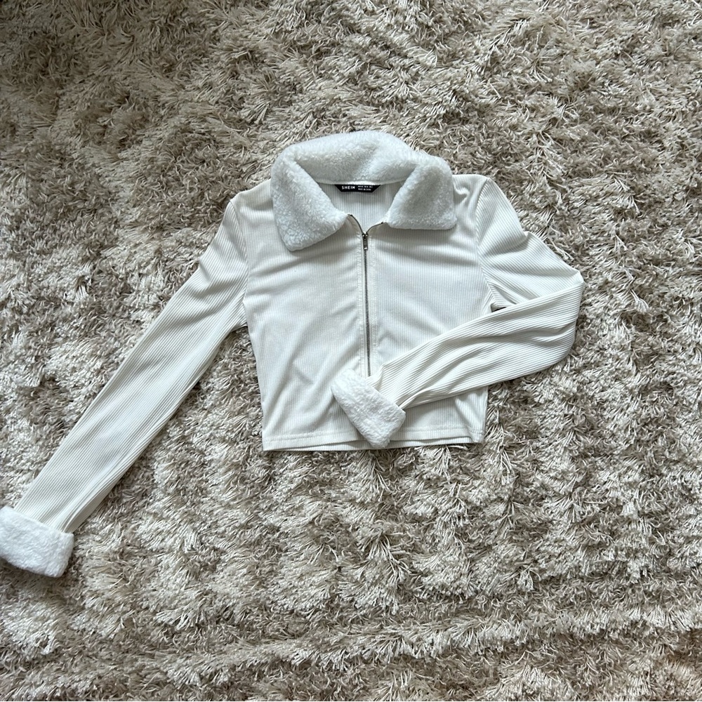 White long sleeve, ribbed, zip up with fluffy trimmed collar and sleeves. Small
